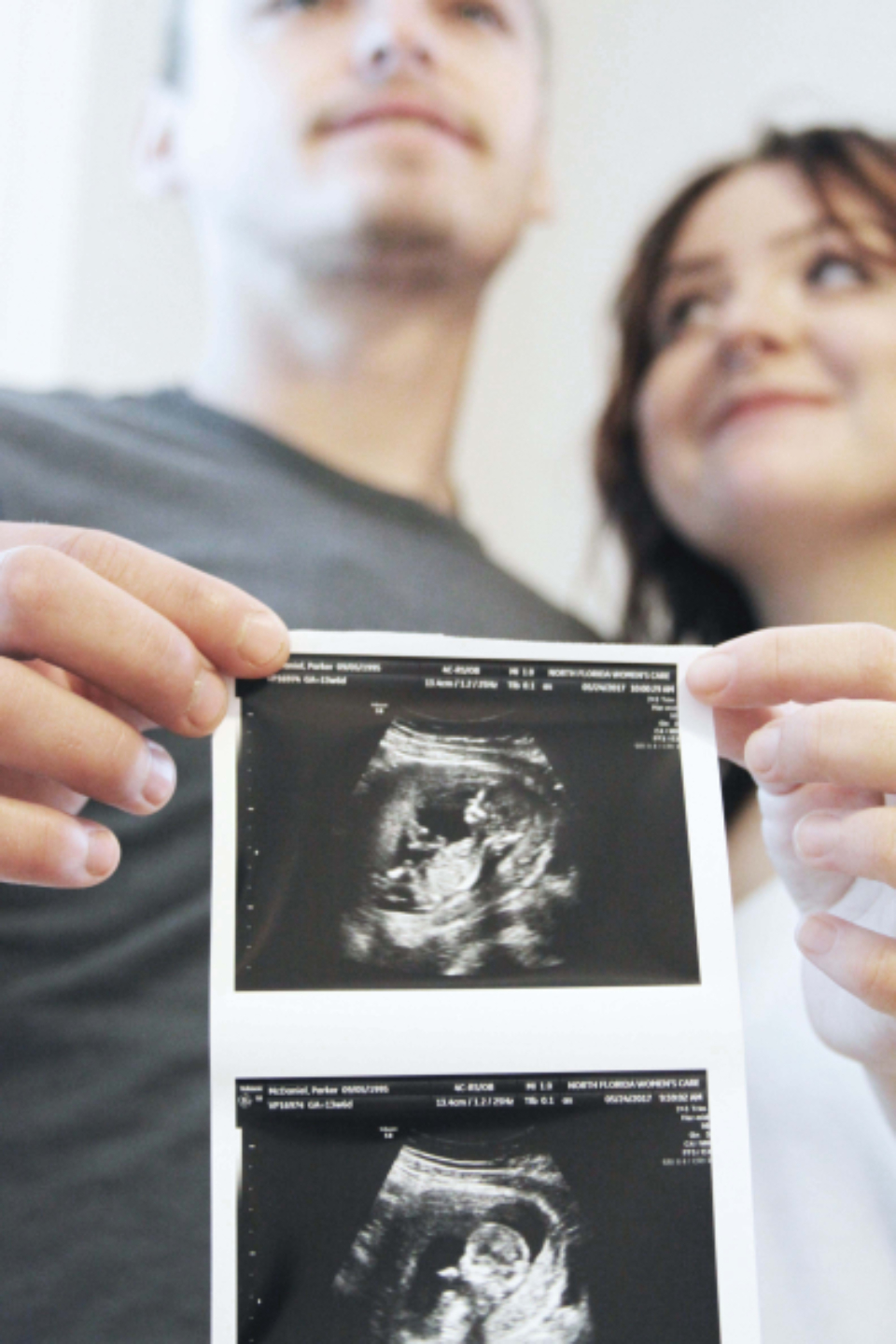 An expectant mother and her partner during a prenatal visit